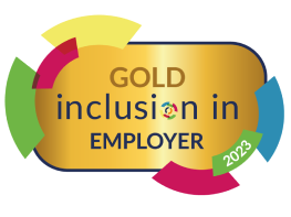 Gold "inclusion in EMPLOYER" award, 2023. Colorful semi-circles around gold badge.