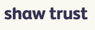 The text 'shaw trust' written in a dark blue, sans-serif font against a light cream background.